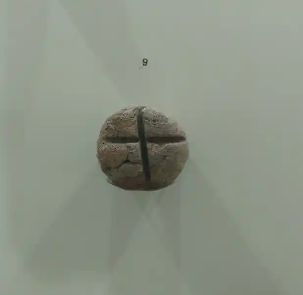 Round stone, solar cross